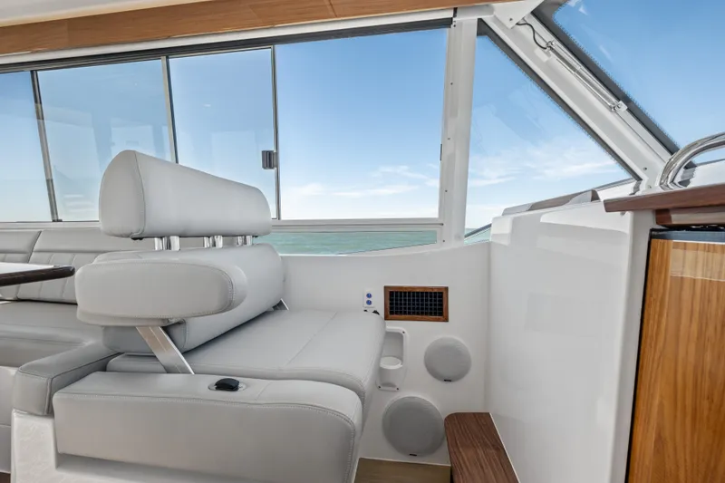 Slide: The Image of Luxurious interior of 2026 MJM 47 R yacht with sleek seating and ocean view. - 11