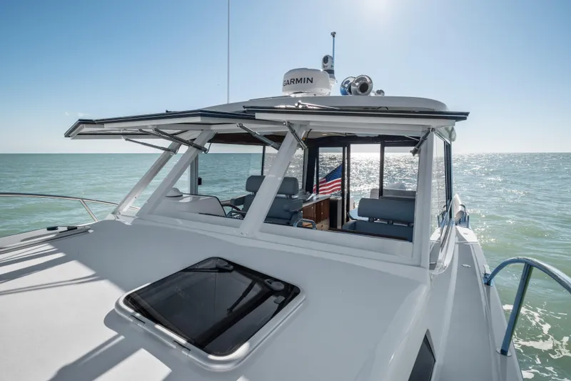 Slide: The Image of MJM 47 R 2026 yacht cruising on open sea under clear sky. - 31