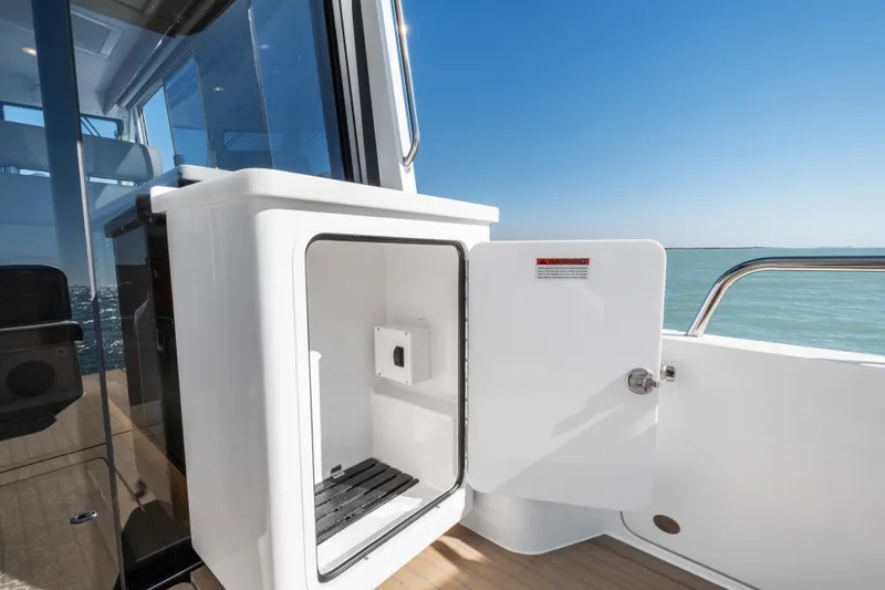 Slide: The Image of Open storage compartment on 2026 MJM 47 R yacht, with ocean view. - 37