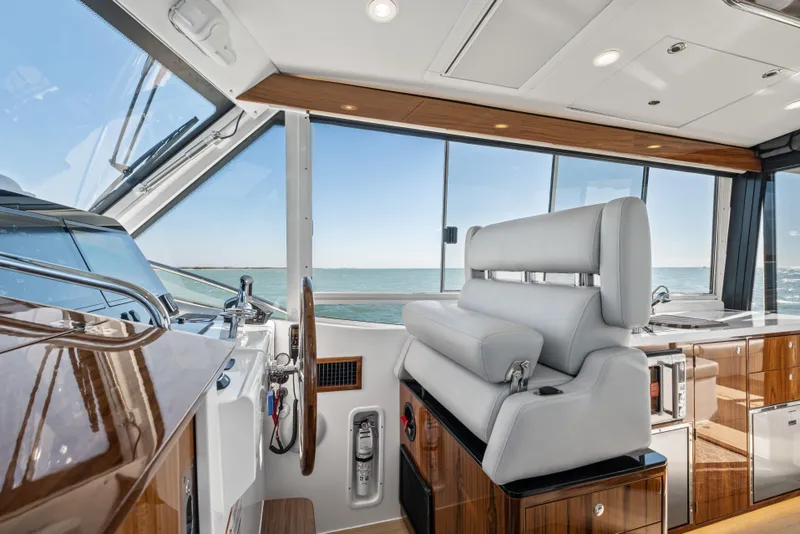 Slide: The Image of Luxurious interior of 2026 MJM 47 R yacht with ocean view and modern helm station. - 6