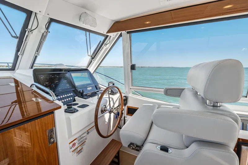 Slide: The Image of Luxurious helm of 2026 MJM 47 R yacht with modern controls and ocean view. - 7