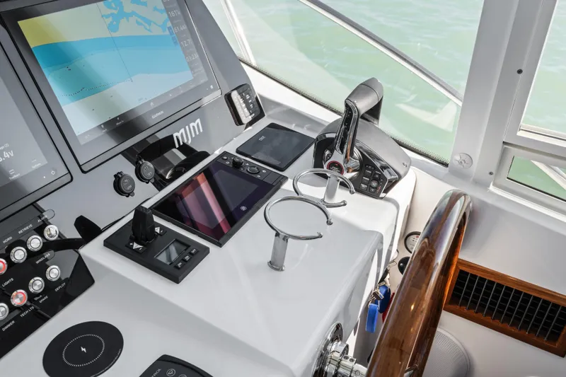 Slide: The Image of Helm of 2026 MJM 47 R yacht with advanced navigation and control systems. - 9