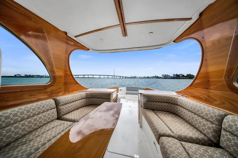 Slide: The Image of Interior of 2013 Hinckley Picnic Boat 37 MKIII with elegant wood finish and plush seating. - 10