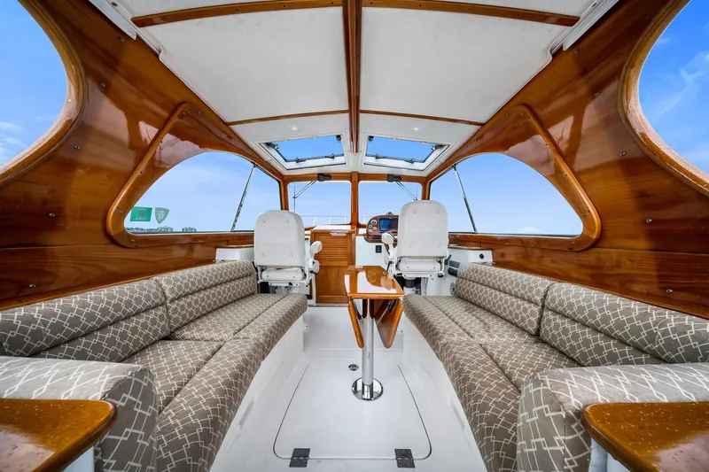 Slide: The Image of Interior of 2013 Hinckley Picnic Boat 37 MKIII with elegant wood finish and plush seating. - 11
