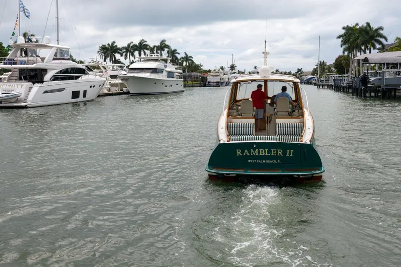 Slide: The Image of Hinckley Picnic Boat 37 MKIII cruising in a marina, West Palm Beach, 2013. - 4
