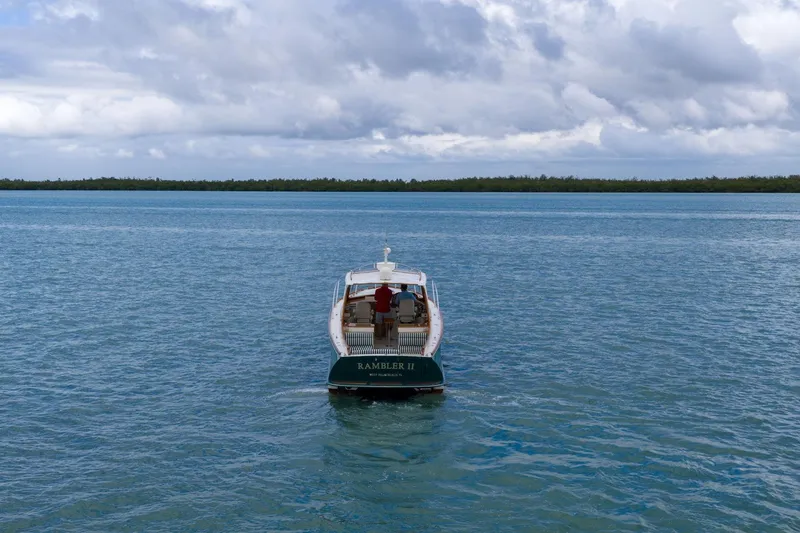 Slide: The Image of Hinckley Picnic Boat 37 MKIII, 2013, cruising on calm blue waters under cloudy skies. - 7