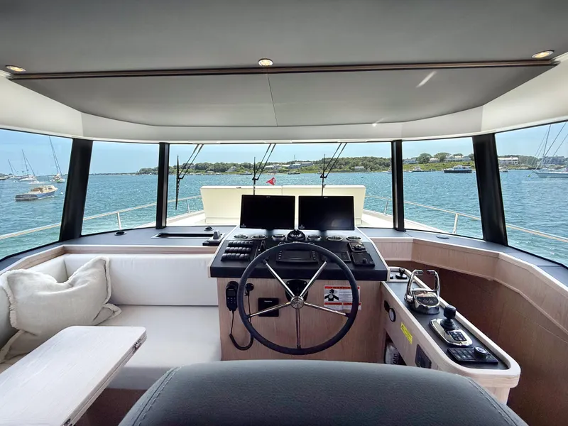 Slide: The Image of Helm of 2026 Beneteau Swift Trawler 54 with panoramic sea view. - 11
