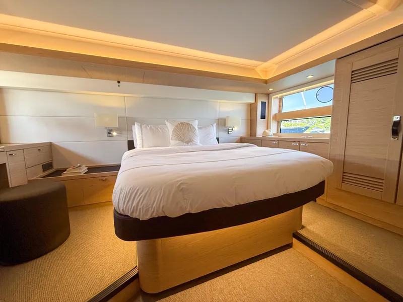 Slide: The Image of Luxurious bedroom interior of 2026 Beneteau Swift Trawler 54 yacht with modern design. - 16