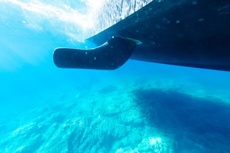 Slide: The Image of Underwater view of 2026 Beneteau Swift Trawler 54 hull in clear blue water. - 32