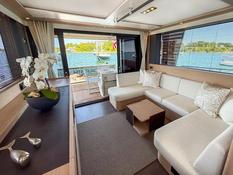 Slide: The Image of Luxurious interior of 2026 Beneteau Swift Trawler 54 with elegant seating and scenic ocean view. - 4