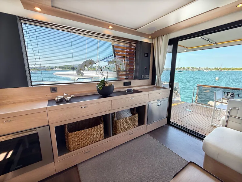 Slide: The Image of Luxurious interior of 2026 Beneteau Swift Trawler 54 with ocean view and modern amenities. - 6