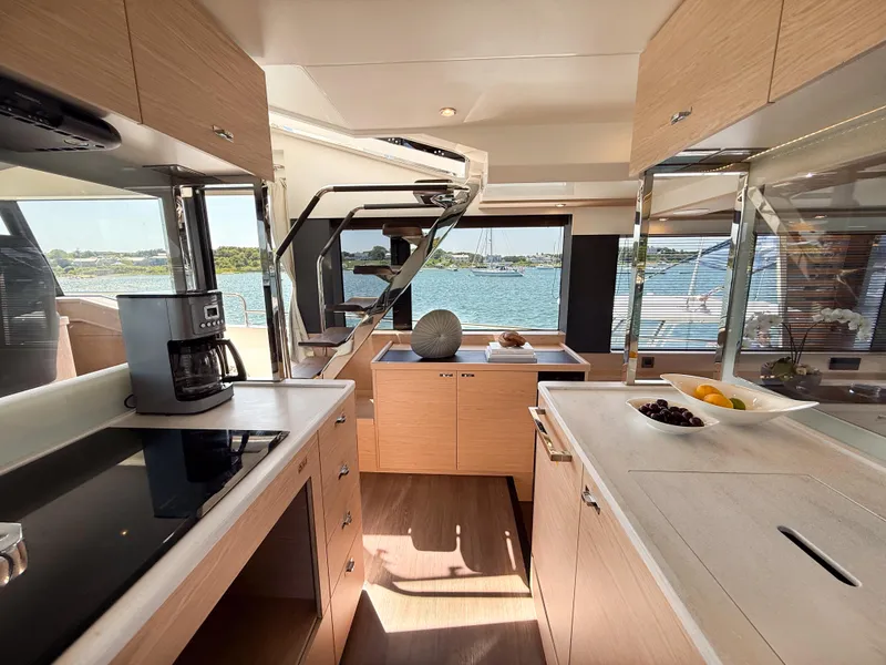 Slide: The Image of Luxurious interior of 2026 Beneteau Swift Trawler 54 with modern kitchen and scenic ocean view. - 9
