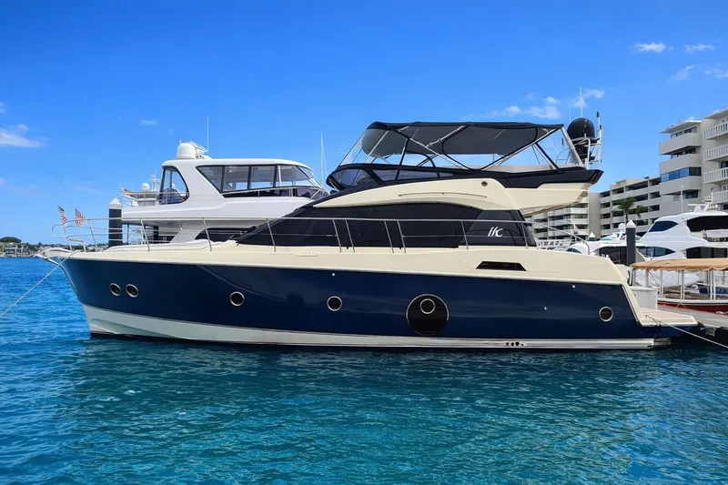 The Image of 2016 Beneteau Monte Carlo 5 yacht docked in clear blue water. - 0