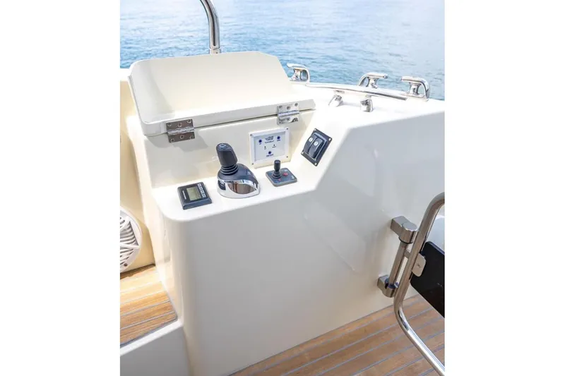 Slide: The Image of Control panel of 2016 Beneteau Monte Carlo 5 yacht, featuring joystick and navigation controls. - 11