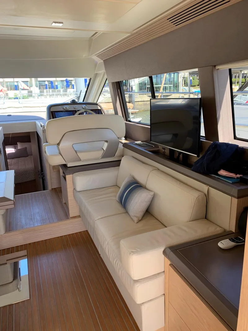 Slide: The Image of Interior of 2016 Beneteau Monte Carlo 5 yacht with elegant furnishings. - 18