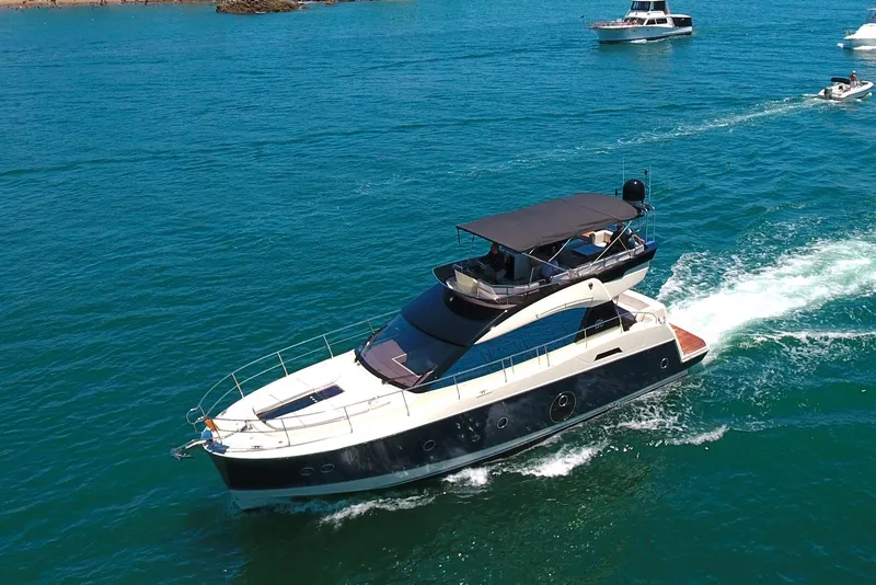 Slide: The Image of 2016 Beneteau Monte Carlo 5 yacht cruising on open water. - 2