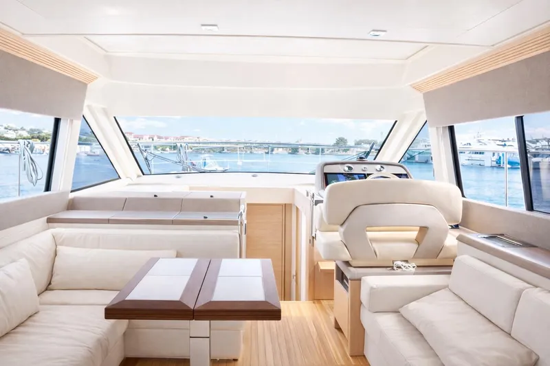 Slide: The Image of Luxurious interior of 2016 Beneteau Monte Carlo 5 yacht with elegant seating and panoramic windows. - 22