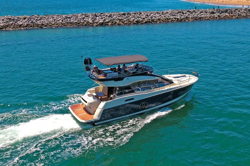 Slide: The Image of 2016 Beneteau Monte Carlo 5 yacht cruising on open sea. - 3