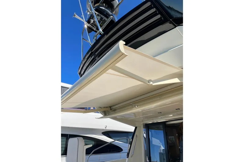 Slide: The Image of 2016 Beneteau Monte Carlo 5 yacht with extended sunshade and sleek design. - 39