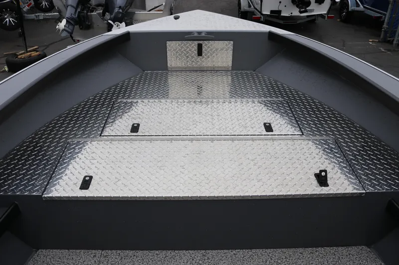 Slide: The Image of Alumaweld Super Vee Pro 23 boat deck with diamond plate flooring, 2026 model. - 10