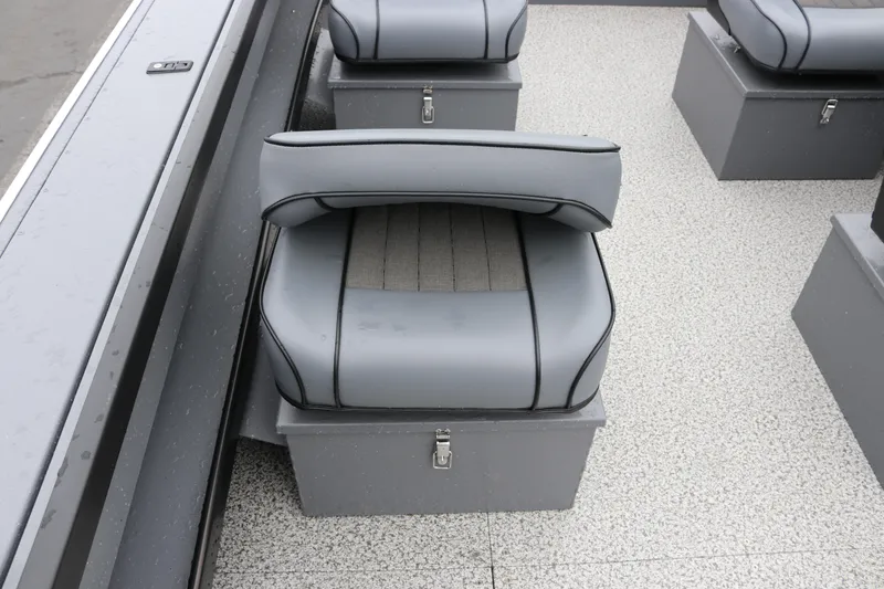 Slide: The Image of 2026 Alumaweld Super Vee Pro 23 boat interior with gray cushioned seating. - 17