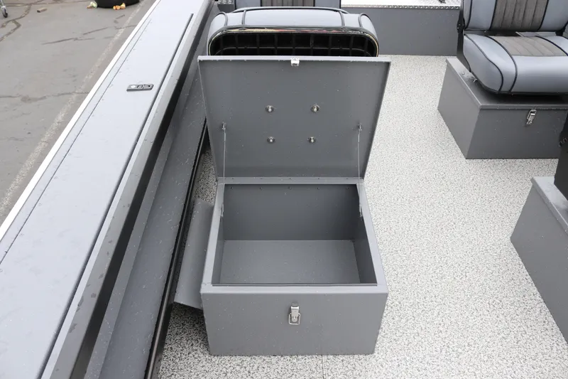 Slide: The Image of 2026 Alumaweld Super Vee Pro 23 boat interior with open storage compartment. - 18