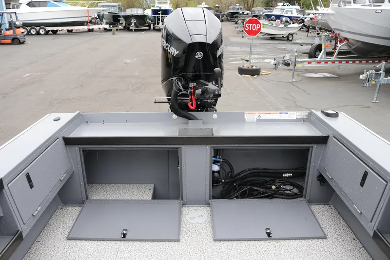 Slide: The Image of 2026 Alumaweld Super Vee Pro 23 boat with Mercury engine, open storage compartments. - 20