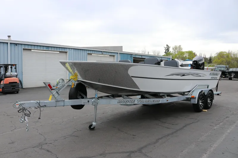 Slide: The Image of 2026 Alumaweld Super Vee Pro 23 boat on Rogue trailer in parking lot. - 7