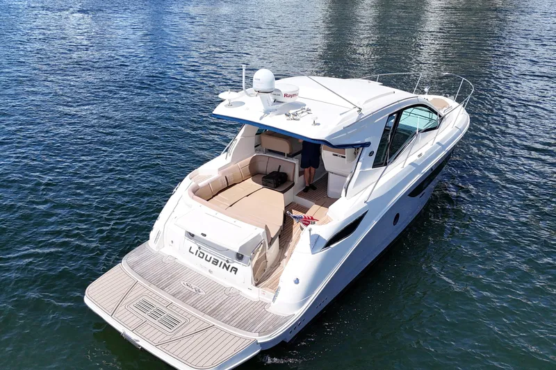 Slide: The Image of 2017 Sea Ray Sundancer 350 Coupe cruising on calm waters. - 110
