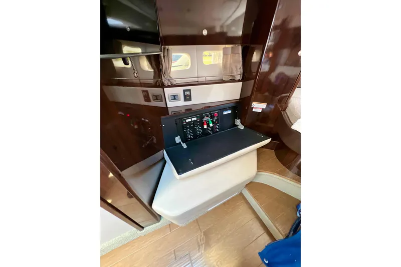 Slide: The Image of 2017 Sea Ray Sundancer 350 Coupe interior control panel with wood finish. - 124