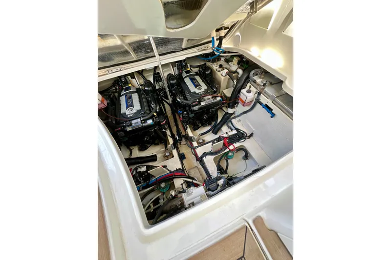 Slide: The Image of Engine compartment of 2017 Sea Ray Sundancer 350 Coupe, showcasing dual engines and wiring. - 127