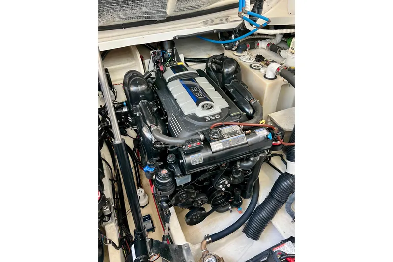 Slide: The Image of Engine compartment of 2017 Sea Ray Sundancer 350 Coupe, showcasing detailed mechanical components. - 129