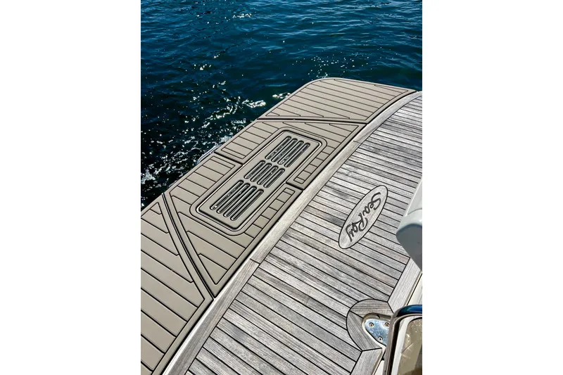 Slide: The Image of 2017 Sea Ray Sundancer 350 Coupe swim platform with teak decking on water. - 20