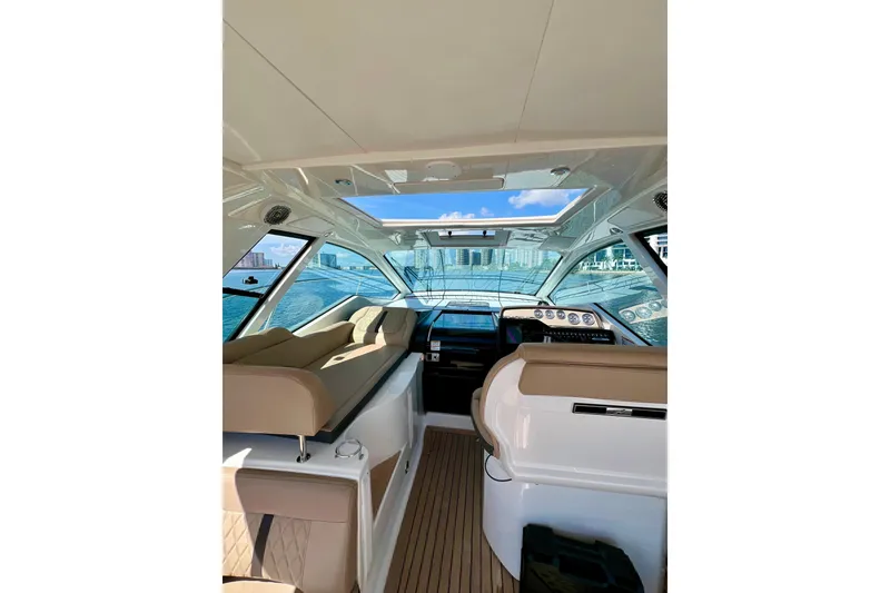 Slide: The Image of Interior of 2017 Sea Ray Sundancer 350 Coupe with panoramic water view. - 29