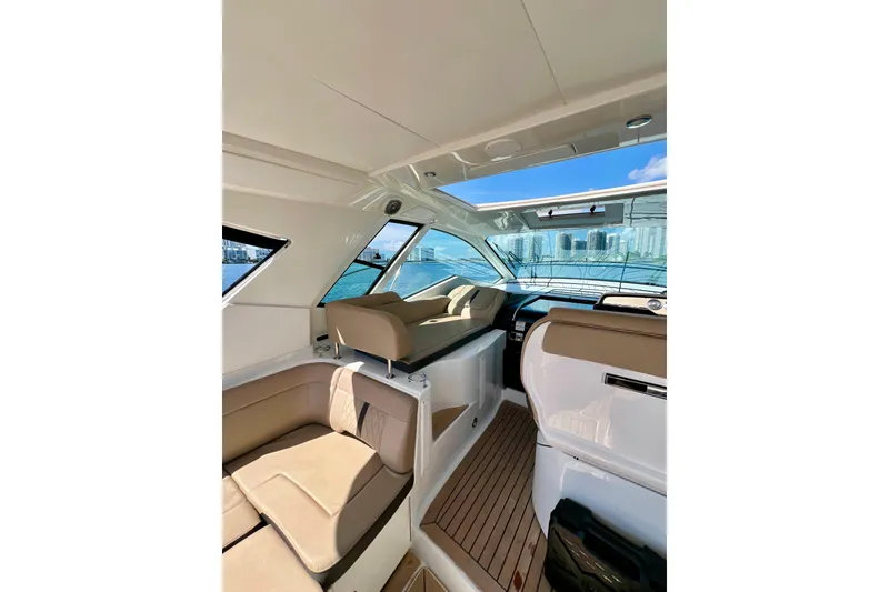 Slide: The Image of Interior of 2017 Sea Ray Sundancer 350 Coupe with luxurious seating and panoramic windows. - 31