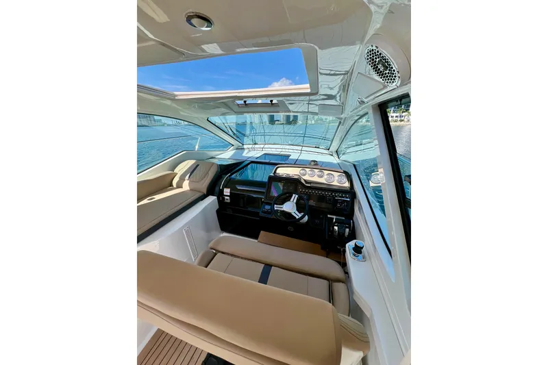 Slide: The Image of Interior of 2017 Sea Ray Sundancer 350 Coupe with modern helm and seating. - 37