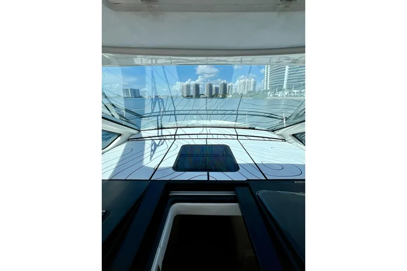 Slide: The Image of 2017 Sea Ray Sundancer 350 Coupe interior view with city skyline in background. - 43