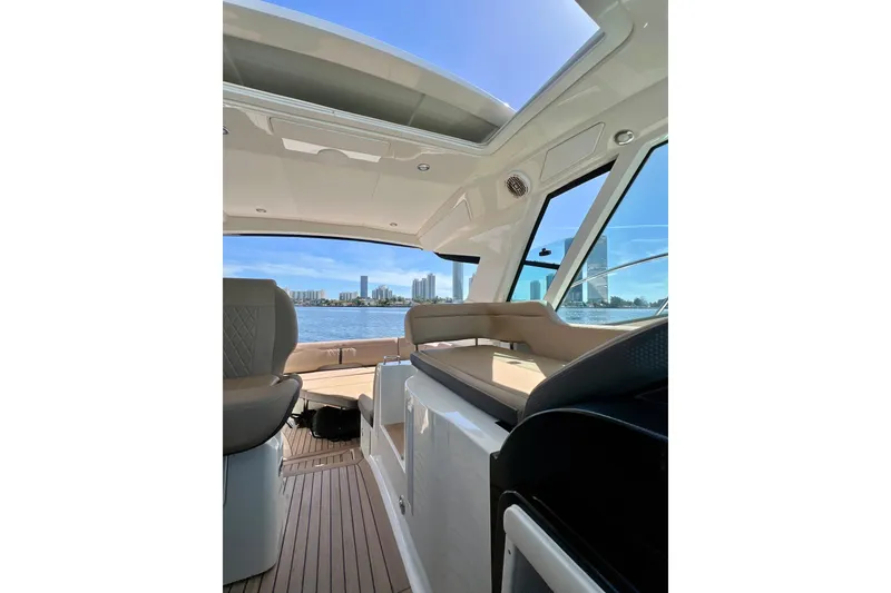Slide: The Image of Interior view of 2017 Sea Ray Sundancer 350 Coupe with city skyline in background. - 44