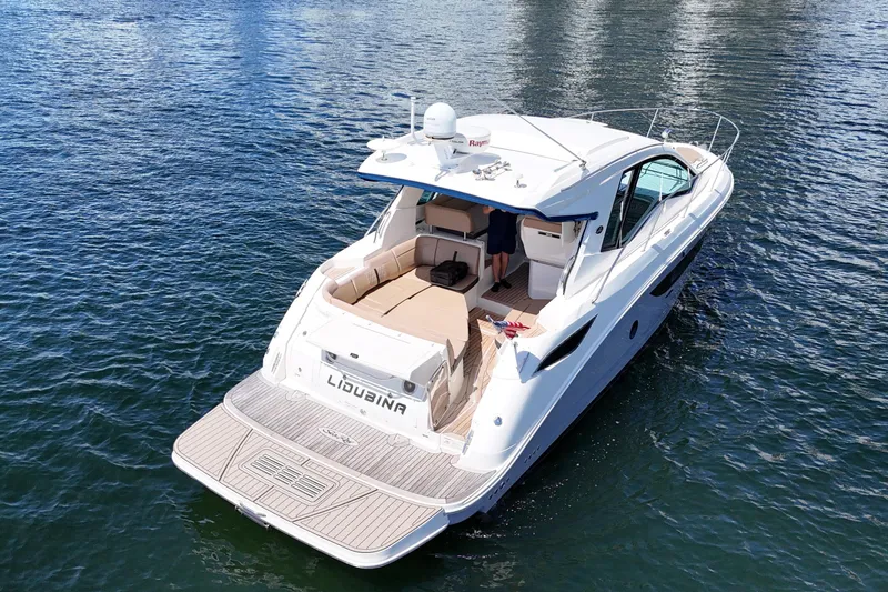 Slide: The Image of 2017 Sea Ray Sundancer 350 Coupe yacht on calm water, rear view. - 5