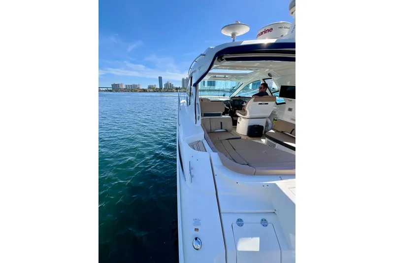 Slide: The Image of 2017 Sea Ray Sundancer 350 Coupe on water, city skyline in background. - 67