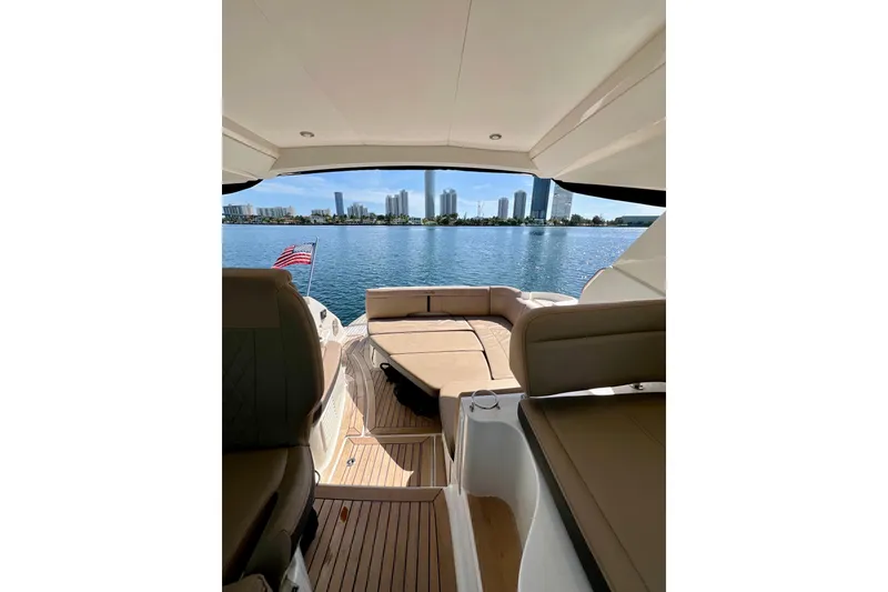 Slide: The Image of 2017 Sea Ray Sundancer 350 Coupe interior with waterfront city skyline view. - 70