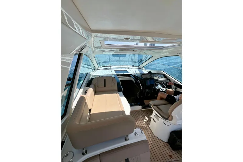 Slide: The Image of Interior of 2017 Sea Ray Sundancer 350 Coupe with modern helm and seating. - 74