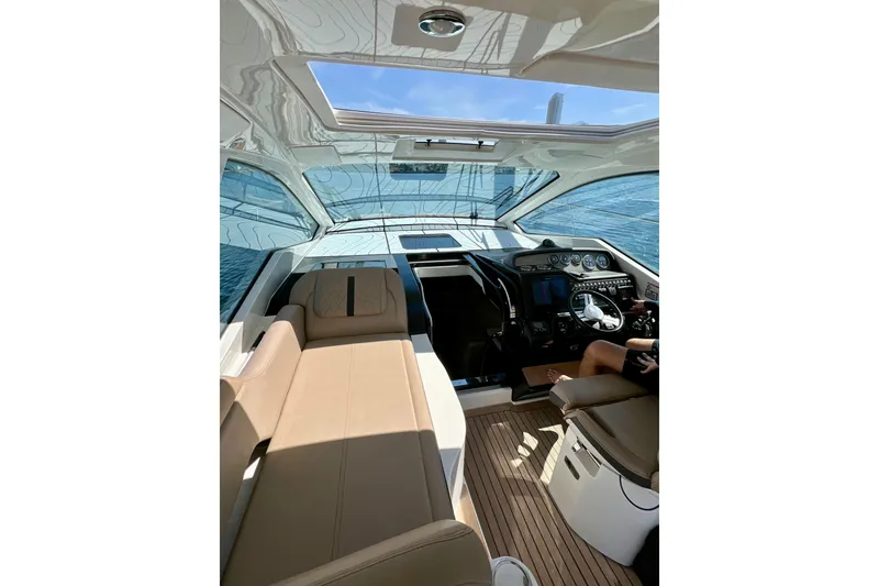Slide: The Image of Interior view of 2017 Sea Ray Sundancer 350 Coupe yacht with modern helm and seating. - 76