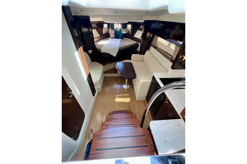 Slide: The Image of Interior of 2017 Sea Ray Sundancer 350 Coupe with elegant seating and wooden flooring. - 82