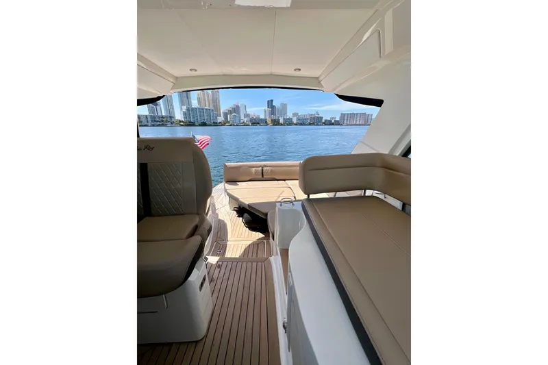 Slide: The Image of 2017 Sea Ray Sundancer 350 Coupe interior with city skyline view. - 86
