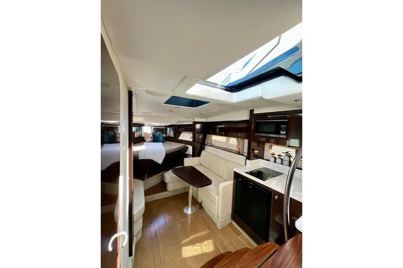 Slide: The Image of Luxurious interior of 2017 Sea Ray Sundancer 350 Coupe with modern amenities and elegant design. - 93