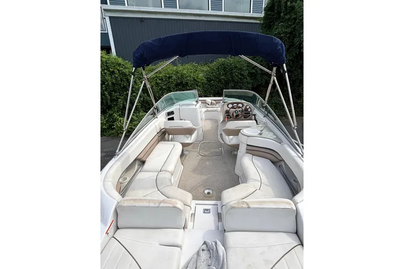 Slide: The Image of 2005 Four Winns 250 Horizon boat interior with seating and canopy. - 3