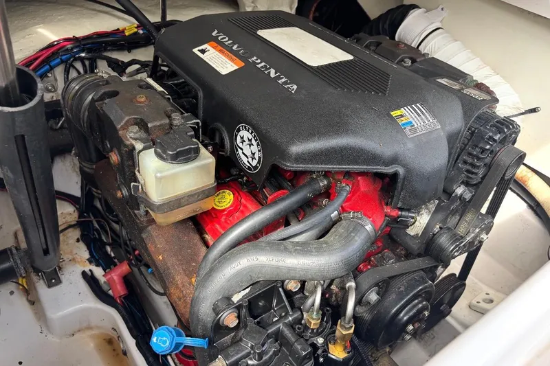 Slide: The Image of Engine of a 2005 Four Winns 250 Horizon boat, featuring Volvo Penta components. - 8