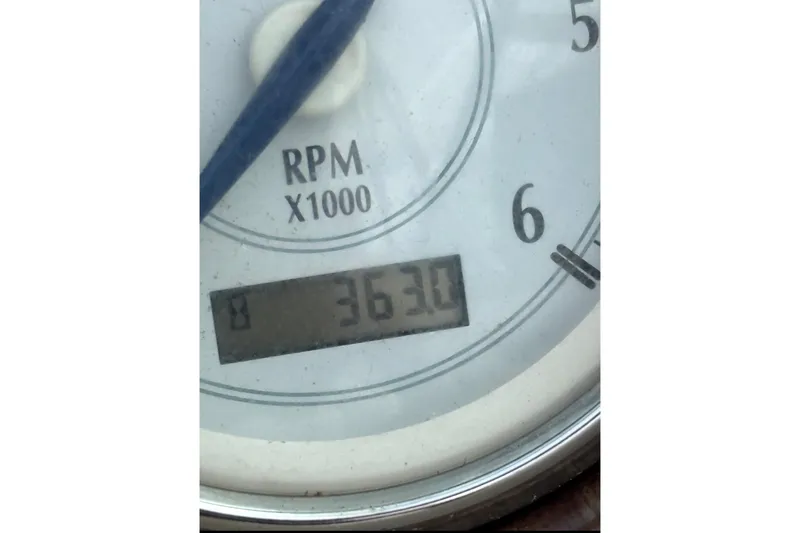 Slide: The Image of Close-up of a 2005 Four Winns 250 Horizon RPM gauge showing 3630 RPM. - 9