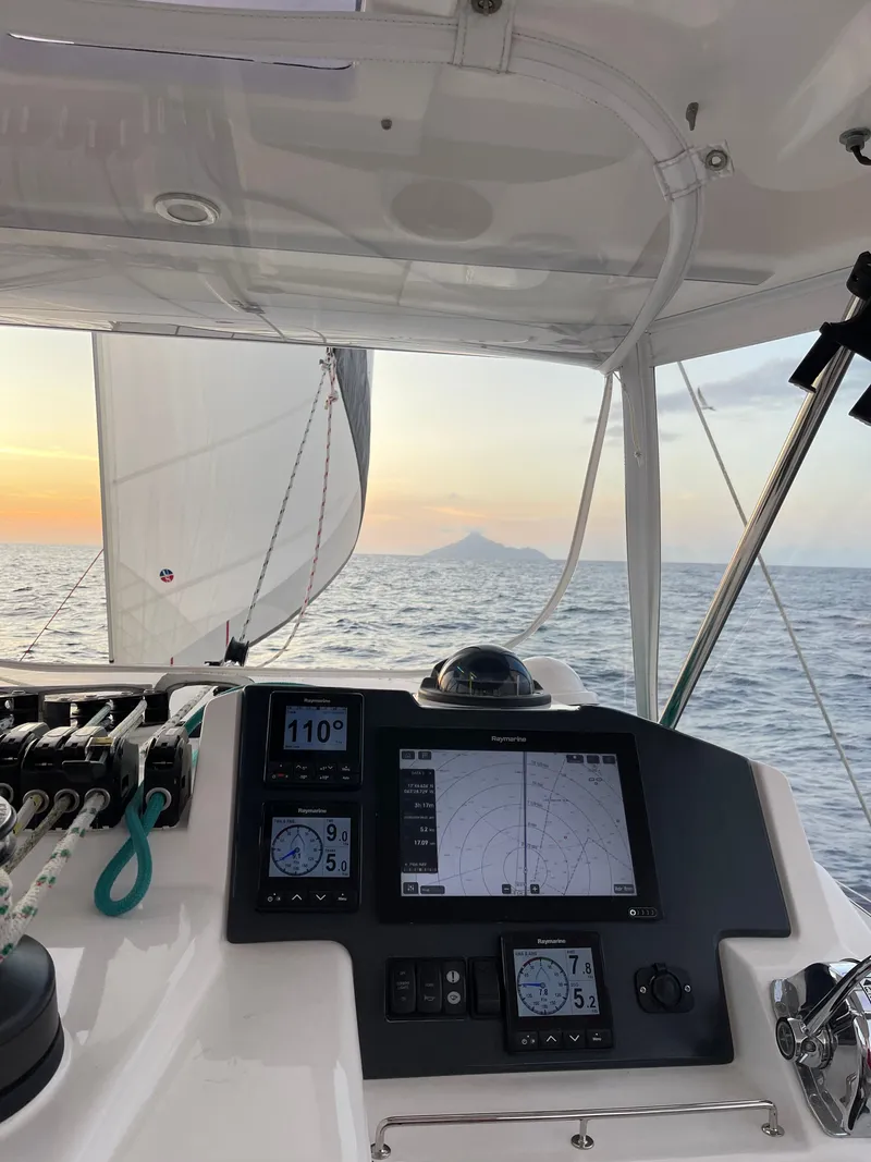 Slide: The Image of Leopard 45 sailboat with navigation system at sunset on the sea. - 15